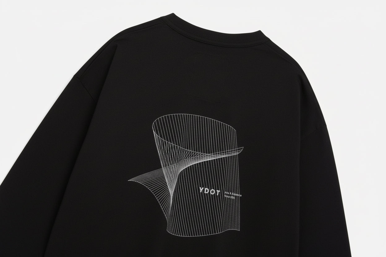 Close-up of a black t-shirt on a white background