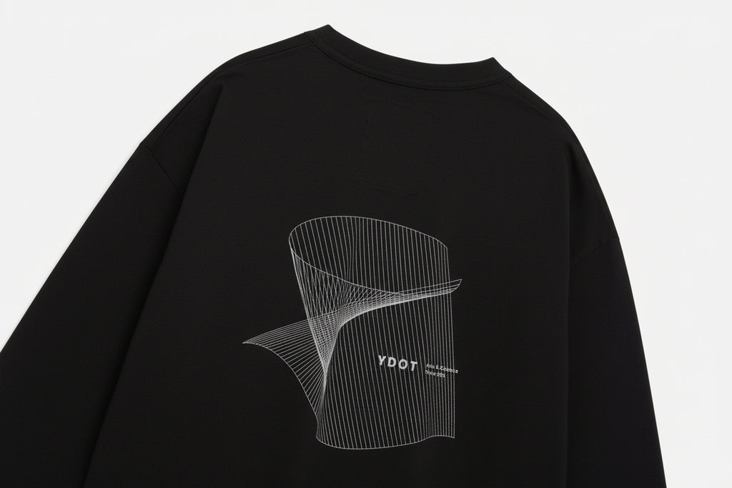 Close-up of a black t-shirt on a white background