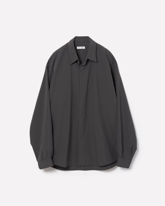 A dark charcoal gray long-sleeve button-up shirt with a relaxed, oversized fit, displayed flat against a light gray background.